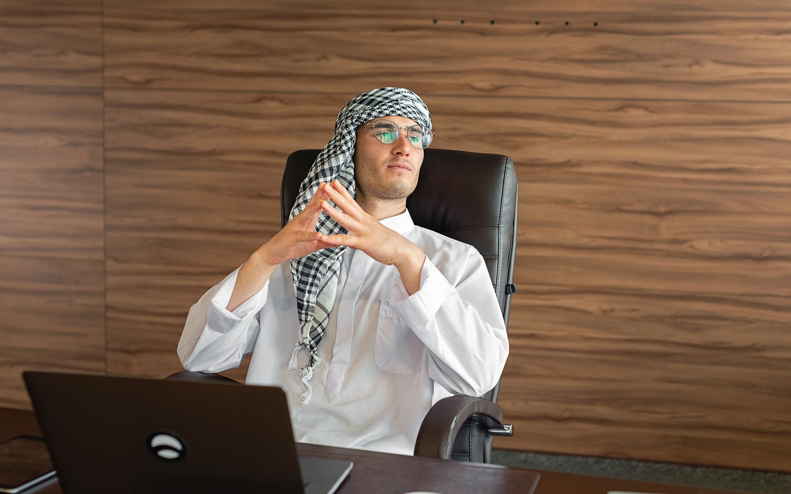 Gulf candidate taking an AI video interview on a laptop
